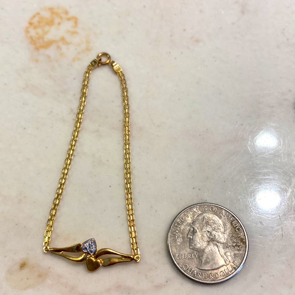 10k yellow gold bracelet with small diamond accent.